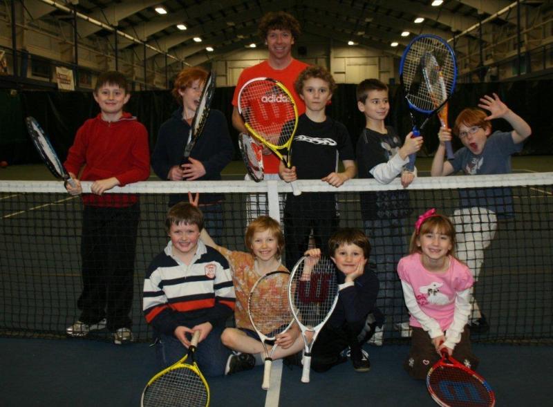 Players after practice January 14 with Coach Alex Arsenault. Below: Rowan Trystan perfects his lunge pose, Griffin Trystan reaches for a hit, Andrew Gudroe awaits Coach Alex Arsenault's serve. LISA KRISTOFF/Boothbay Register
Players after practice January 14 with Coach Alex Arsenault. LISA KRISTOFF/Boothbay Register