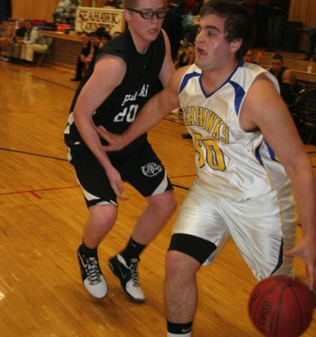 Linc Simmons drives the baseline against Hall-Dale's Brian Allen Saturday night. Simmons scored 12 points to help lead the Boothbay Region High School Boys' Varsity Basketball team to a 52-50 win at Porter Memorial Gymnasium. Below: Steve Barter sets to get off a shot against Hall-Dale. KEVIN BURNHAM/Boothbay Register Linc Simmons drives the baseline against Hall-Dale's Brian Allen Saturday night. Simmons scored 12 points to help lead the Boothbay Region High School Boys' Varsity Basketball team to a 52-50 win at Porter Memorial Gymnasium.