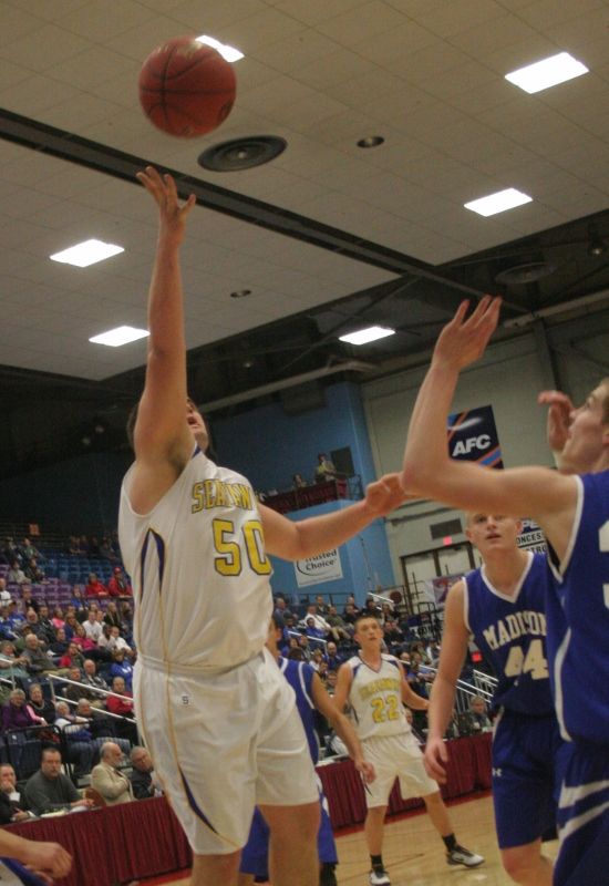 Linc Simmons tosses up a one-hander for two points in the second half. KEVIN BURNHAM/Boothbay Register Linc Simmons tosses up a one-hander for two points in the second half. KEVIN BURNHAM/Boothbay Register