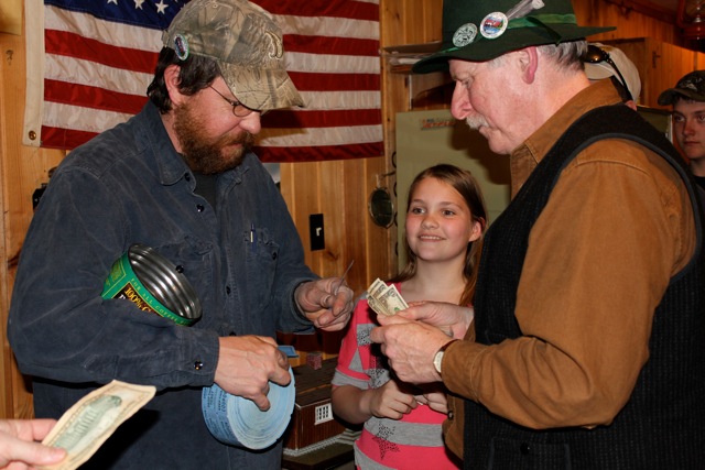 Treasurer Keith Royal sells a raffle ticket to Earl Leavitt as Jackie Steinmetz eagerly waits her turn. The monthly $1 raffle drew a long line. SUE MELLO/Boothbay Register Treasurer Keith Royal sells a raffle ticket to Earl Leavitt as Jackie Steinmetz eagerly waits her turn. The monthly $1 raffle drew a long line. SUE MELLO/Boothbay Register