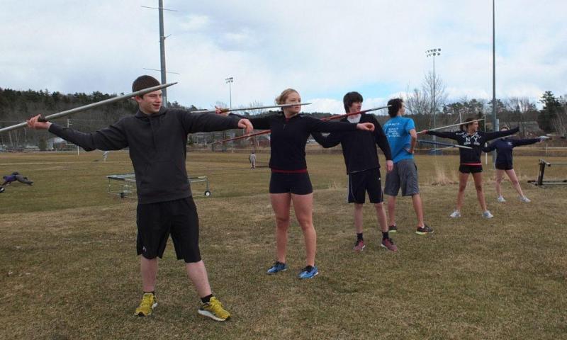 Javelin throwers poised to throw spears during track and field practice at Boothbay Region High School April 2. Below: Antonio Maulolo, a new face on the team, is learning the technique of throwing the shot put. RYAN LEIGHTON/Boothbay Register Javelin throwers poised to throw spears during track and field practice at Boothbay Region High School April 2. RYAN LEIGHTON/Staff Reporter