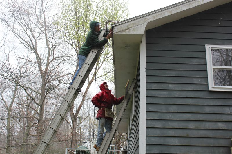 Bill Hamblen and Derek Abbot make repairs at a house on King Phillips Trail. SUE MELLO/Boothbay Register Bill Hamblen and Derek Abbot make repairs at a house on King Phillips Trail. SUE MELLO/Boothbay Register