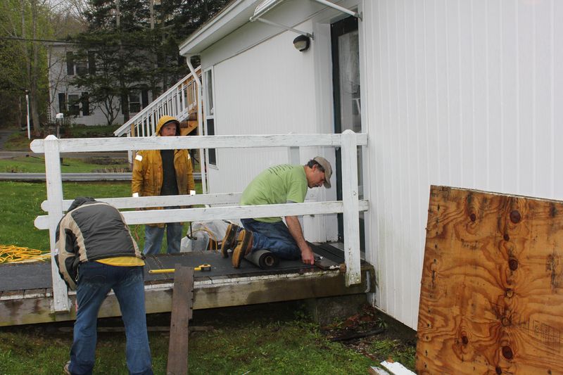 Dean Domeyer, Tiger and Peanut fixing a ramp at the Boothbay Green. SUE MELLO/Boothbay Register Dean Domeyer, Tiger and Peanut fixing a ramp at the Boothbay Green. SUE MELLO/Boothbay Register