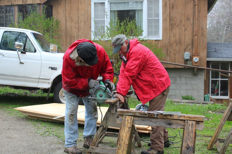 Seth Hedgcock, left, and Tony Curulla cut boards for siding repair at a house on King Phillips Trail. SUE MELLO/Boothbay Register Seth Hedgcock, left, and Tony Curulla cut boards for siding repair at a house on King Phillips Trail. SUE MELLO/Boothbay Register
