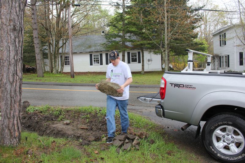 Ben Dewey unloads rocks at Boothbay Green. SUE MELLO/Boothbay Register Ben Dewey unloads rocks at Boothbay Green. SUE MELLO/Boothbay Register