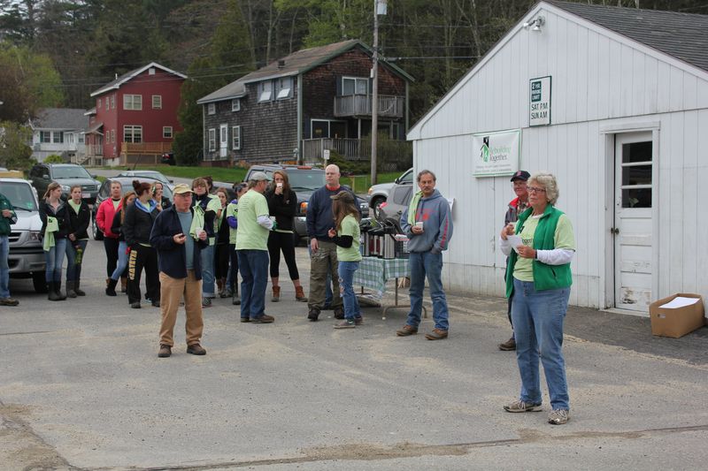 Sally Barter gives initial directions to the crew assembled at the catholic church's parking lot at 7:30 a.m. The high school softball team is pictured at left. Below: Bill Hamblen and Derek Abbot make repairs at a house on King Phillips Trail. SUE MELLO/Boothbay Register Sally Barter gives initial directions to the crew assembled at the catholic church's parking lot at 7:30 a.m. The high school softball team is pictured at left. SUE MELLO/Boothbay Register