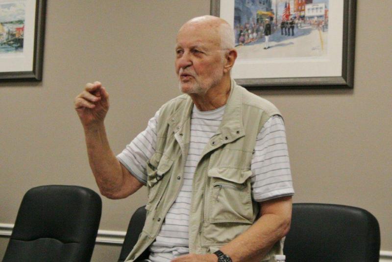 Jack Perkins describes living in relative isolation on an island off Bar Harbor. Perkins spoke to a crowd of approximately 45 people at the season's last Literary Luncheon, organized by the Boothbay Harbor Memorial Library. NICOLE LYONS/Boothbay Register Jack Perkins describes living in relative isolation on an island off Bar Harbor. Perkins spoke to a crowd of approximately 45 people at the season's last Literary Luncheon, organized by the Boothbay Harbor Memorial Library. NICOLE LYONS/Boothbay Register