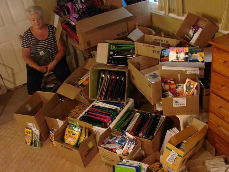 Sue Burge with donations in 2012. SUSAN JOHNS/Boothbay Register. Below: Burge with some of the items in the “Gifts For Learning” for children on the peninsula ages 4 through 12. LISA KRISTOFF/Boothbay Register Sue Burge with donations in 2012. SUSAN JOHNS/Boothbay Register.