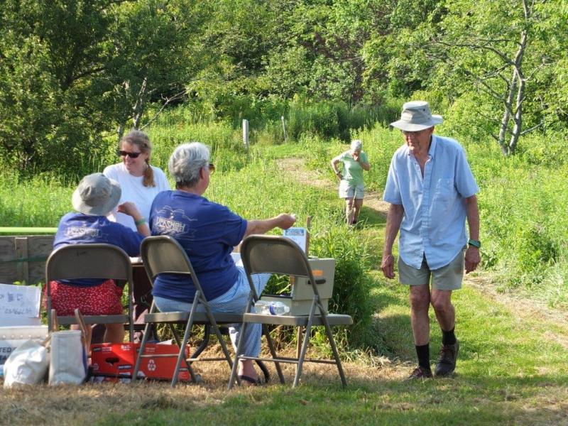 Hungry hikers make their way to the entrance of the German-style grill party held at Penny Lake Preserve. RYAN LEIGHTON/Boothbay Register Hungry hikers make their way to the entrance of the German-style grill party held at Penny Lake Preserve. RYAN LEIGHTON/Boothbay Register