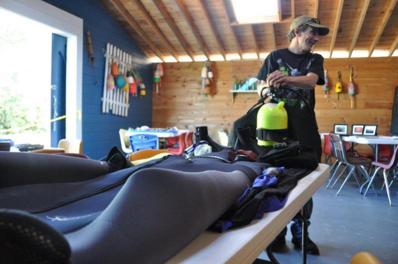 Boone, who weighs approximately 135 pounds, said he doubles his weight with all the gear he dives with. BEN BULKELEY/Boothbay Register Boone, who weighs approximately 135 pounds, said he doubles his weight with all the gear he dives with. BEN BULKELEY/Boothbay Register