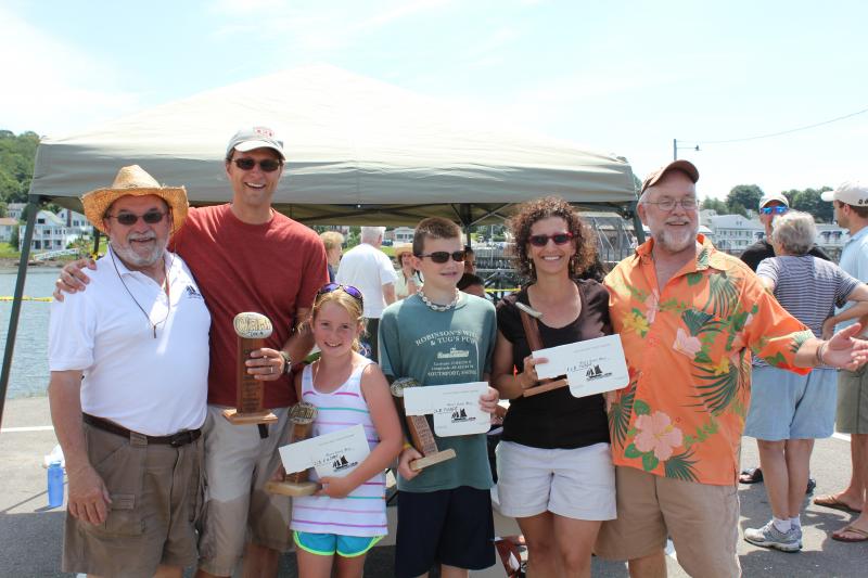 Flanked by rock skipping’s founding fathers John, left, and Arthur Webster, right, the 2013 Orne’s Candy Store Rock Skipping Champions proudly display their prizes: a handcrafted trophy and one pound of rocky road fudge. Left to right, men's champ Jason “Loose Cannon” Harrington, girls’ winner, Anna "Carbonator" Carbone, boys' winner, Tristan "Rocky Point" Smith, and women’s champ, Kim ‘Mskim’ Webster. SUE MELLO/Boothbay Register Flanked by rock skipping’s founding fathers John, left, and Arthur Webster, right, the 2013 Orne’s Candy Store Rock Skipping Champions proudly display their prizes: a handcrafted trophy and one pound of rocky road fudge. Left to right, men's champ Jason “Loose Cannon” Harrington, girls’ winner, Anna "Carbonator" Carbone, boys' winner, Tristan "Rocky Point" Smith, and women’s champ, Kim ‘Mskim’ Webster. SUE MELLO/Boothbay Register