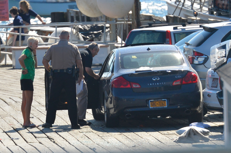 From right, Knox County Sheriff's Lt. Kirk Guerette, Sgt. John Palmer and car driver Cheryl Torgerson of New York City. (Photo by Ron Hawkes)