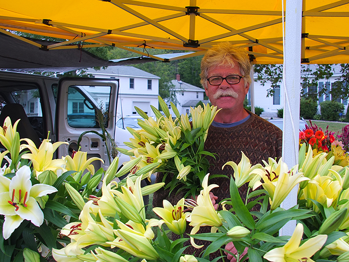 Jim Mercer of Sheepscot Flower Farm with his lillies. SUZI THAYER/Boothbay Register Jim Mercer of Sheepscot Flower Farm with his lillies. SUZI THAYER/Boothbay Register