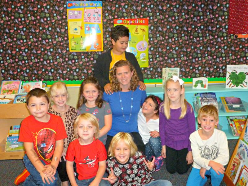 New first grade teacher Lindsey Ingraham, center, surrounded by her students who were “green” for the week. Green means perfect behavior, and their reward was eating lunch in the classroom with her. Students from left are: Dean Brewer, Lilliana Nein, Scarlett O'Brien, Zaid Osman, Angelina Patriotti, Madeline Orchard, Wyatt Lorrain. In front are Lysander LeFerre and Anna Elizarkov. KATRINA CLARK/Boothbay Register New first grade teacher Lindsey Ingraham, center, surrounded by her students who were “green” for the week. Green means perfect behavior, and their reward was eating lunch in the classroom with her. Students from left are: Dean Brewer, Lilliana Nein, Scarlett O'Brien, Zaid Osman, Angelina Patriotti, Madeline Orchard, Wyatt Lorrain. In front are Lysander LeFerre and Anna Elizarkov. KATRINA CLARK/Boothbay Register