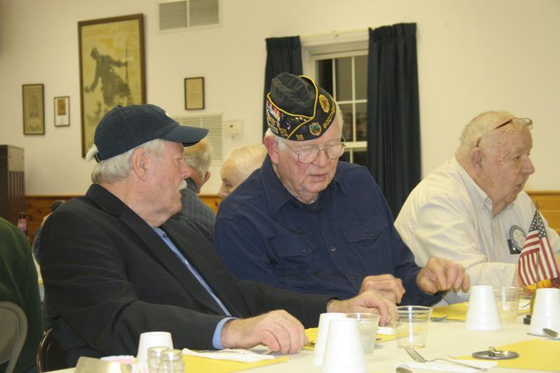 Veterans Bob Jacobson and Palmer Payne have a conversation before the Rotary dinner. At right is Rotarian Bill Kautzmann. KEVIN BURNHAM/Boothbay Register Veterans Bob Jacobson and Palmer Payne have a conversation before the Rotary dinner. At right is Rotarian Bill Kautzmann. KEVIN BURNHAM/Boothbay Register