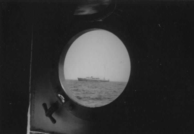A view of a Russian fishing vessel through the porthole of the United States Coast Guard Cutter Acushnet. Courtesy of Rusty Court