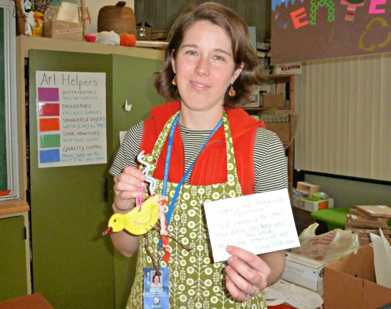 Boothbay Region Elementary School art teacher Jessica Nadeau holds a finished Hope Bird and the verse from an Emily Dickinson poem that inspired the project. KATRINA CLARK/Boothbay Register
