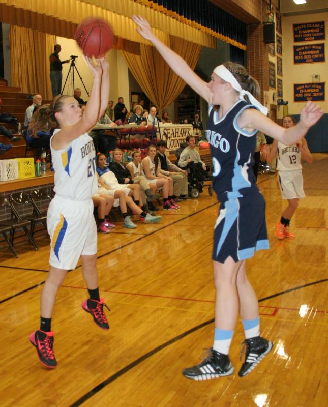 Sophomore Hannah Morley shoots a three over the outstretched arm of Dirigo’s Jessica Conant during the second half of Wednesday’s game at BRHS. KEVIN BURNHAM/Boothbay Register Morley