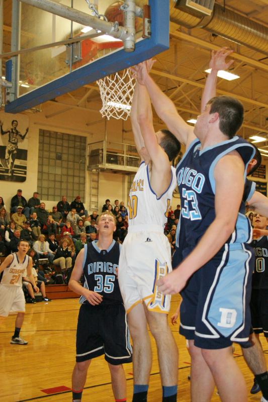 John Hepburn goes up and over Dirigo’s Dylan Kidder to score two of his game-high 20 points in Wednesday’s contest. KEVIN BURNHAM/Boothbay Register Hepburn