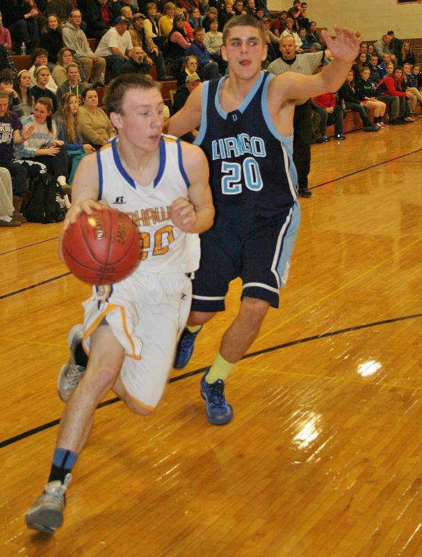 Nick Kilgus drive hard to the hoop against Dirigo. KEVIN BURNHAM/Boothbay Register Kilgus