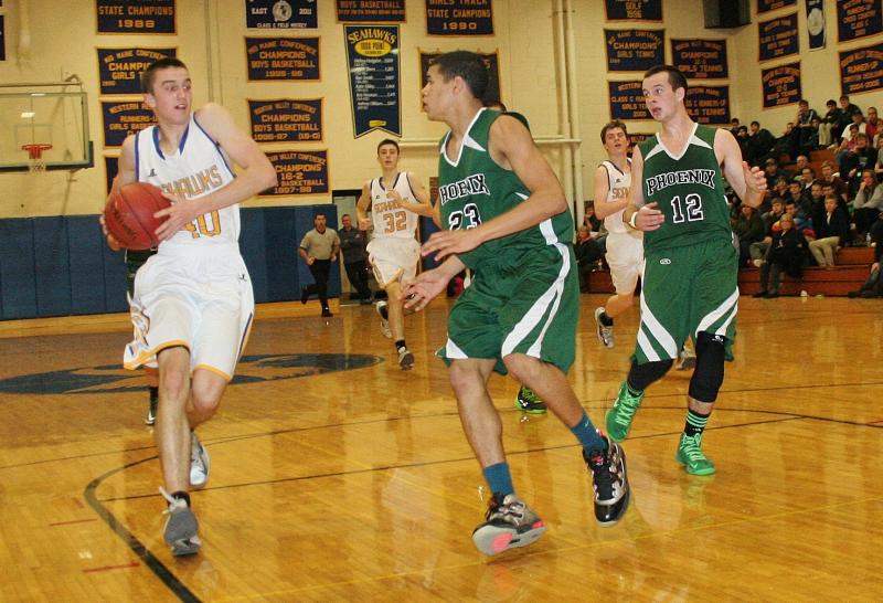 John Hepburn drives to the basket in Thursday’s game against Spruce Mountain. Hepburn scored 32 points to lead Boothbay in the double-overtime victory. KEVIN BURNHAM/Boothbay Register Hepburn, John