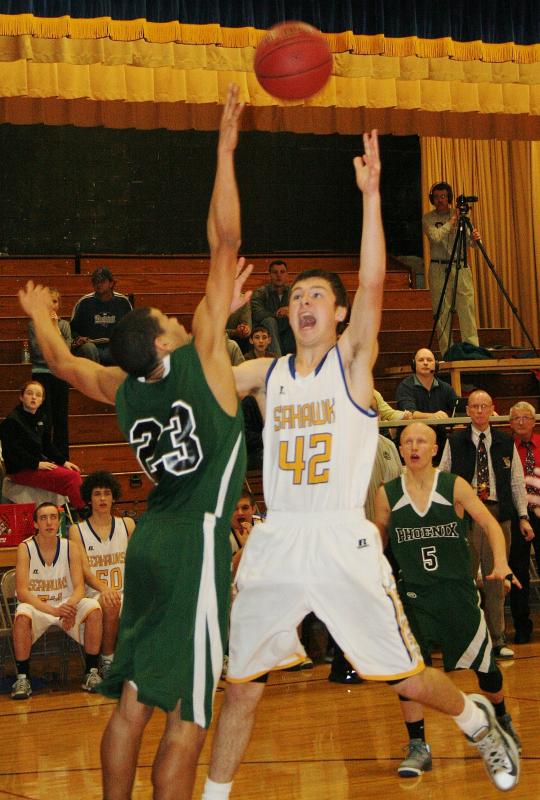Brad Drummond puts up a shot over a Spruce Mountain defender in overtime. KEVIN BURNHAM/Boothbay Register Drummond