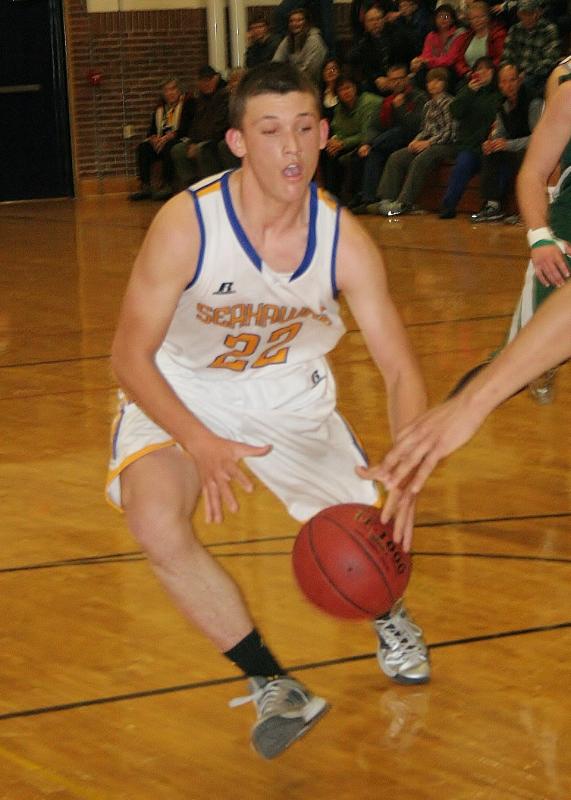 Senior co-captain Andrew Hallinan uses a crossover dribble to get into the lane for a shot. KEVIN BURNHAM/Boothbay Register Hallinan