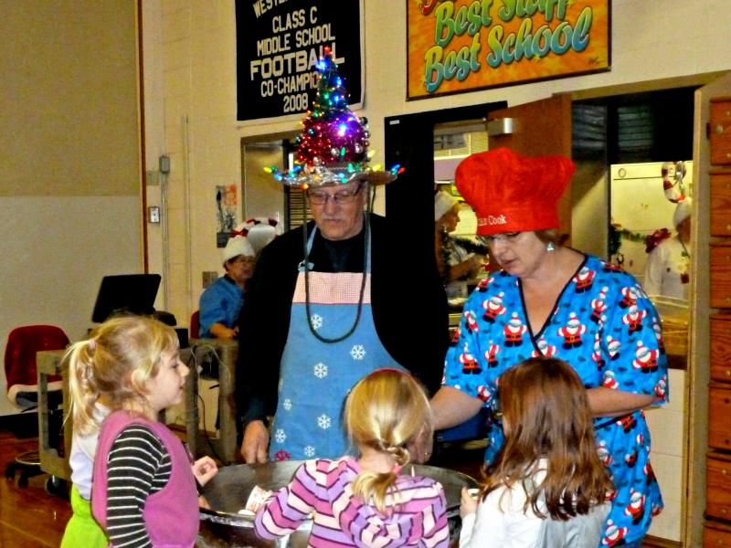 Ronald French is swarmed by kids when he wheels out the huge bowl of ice cream. KATRINA CLARK/Boothbay Register
