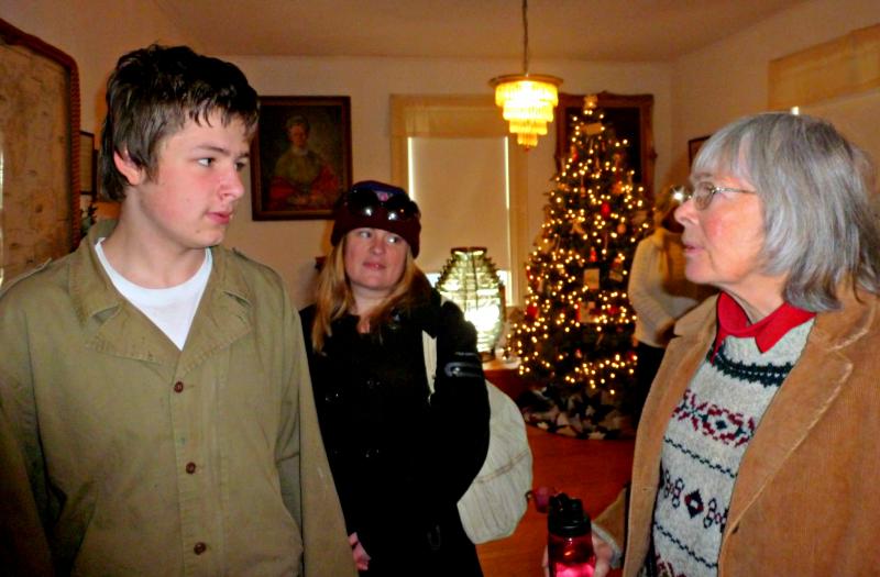 Barbara Rumsey, right, talks to researcher Devyn Campbell while his mom looks on. KATRINA CLARK/Boothbay Register
