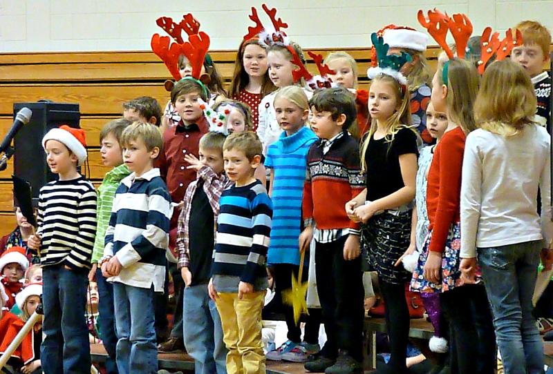 Second graders sports antlers singing “Must Be Santa” at the holiday concert at BRES. KATRINA CLARK/Boothbay Register