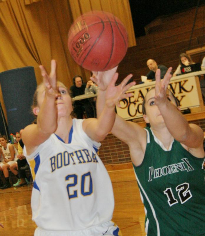 Boothbay guard Hannah Morley and Spruce Mountain guard Ladesta Tracy battle for a loose ball during Wednesday’s game at Boothbay Region High School. KEVIN BURNHAM/Boothbay Register Morley