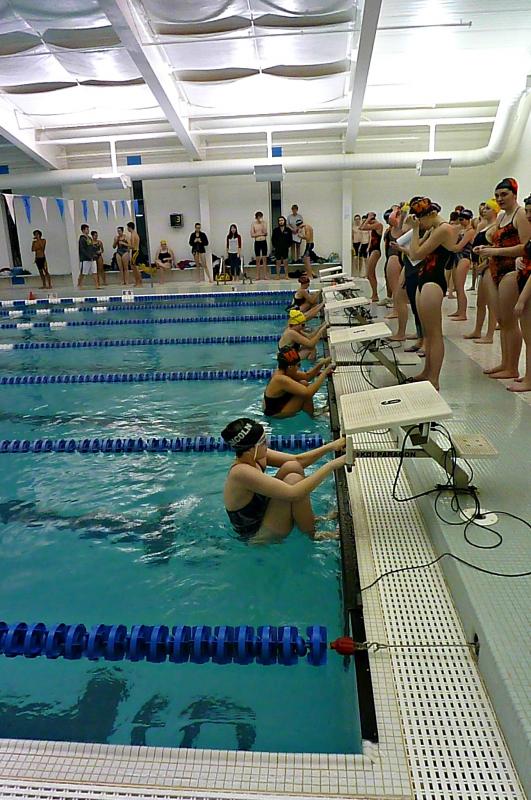 Starting position for the girls 100-yard backstroke. From top to bottom: Audrey Jones of Winslow, Elizabeth Gilbert of Lincoln Academy, Chelsea Graves of Boothbay Region High School, Courtney of Colford of Winslow, and Thalia Eddy-Blouin of Lincoln Academy. KATRINA CLARK/Boothbay Register