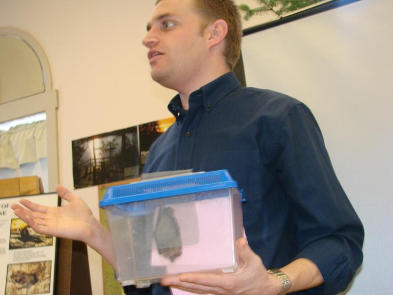 Keith Crowley, director of Chewonki’s traveling natural history programs, speaks to the Wiscasset Garden Club January. Inside the container Crowley is holding is August, an injured big brown bat who can no longer live in the wild. SUSAN JOHNS/Wiscasset Newspaper Keith Crowley Chewonki Foundation Wiscasset