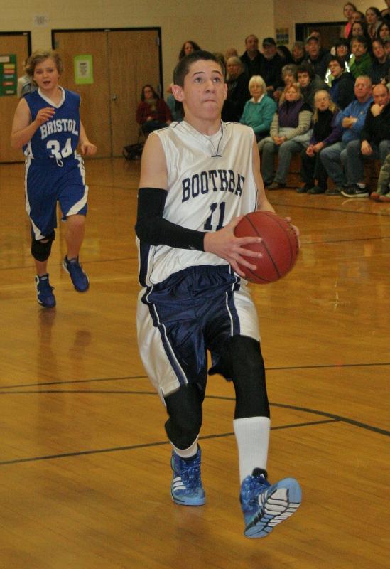 Keegan Giles goes in for an easy layup for the eighth grade boys in Thursday’s game against Bristol. KEVIN BURNHAM/Boothbay Register Giles