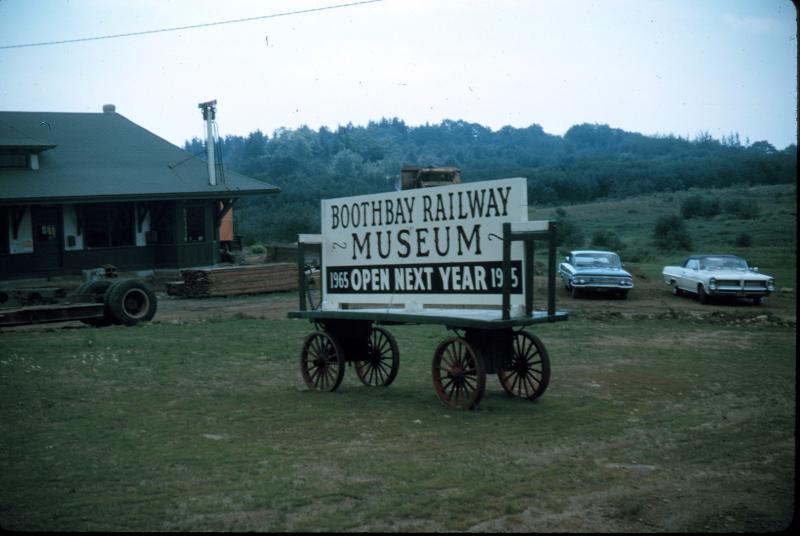 As work progressed, a sign was posted to announce the planned 1965 opening of the Boothbay Railway Museum.