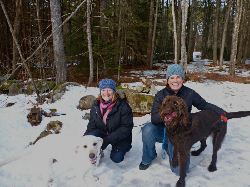 Tracey Hall, right, and her Labradoodle Cedar joined Lauren Stockwell, left, with her yellow Lab Ella on the first ever Boothbay Region Land Trust “Tails on the Trails” dog hike. KATRINA CLARK/Boothbay Register