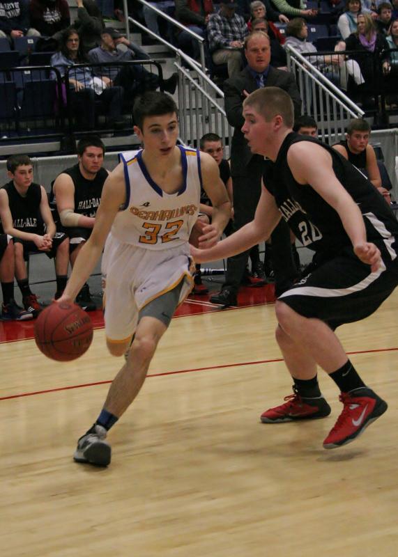 Junior forward Joseph DiMauro tries to drive the baseline against a Hall-Dale defender during the first half of the tournament game against Hall-Dale on Monday. KEVIN BURNHAM/Boothbay Register DiMauro