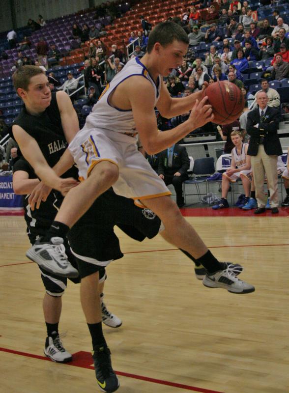 Senior point guard Andrew Hallinan hauls down a rebound during Monday’s Class C tournament game against Hall-Dale. KEVIN BURNHAM/Boothbay Register Hallinan