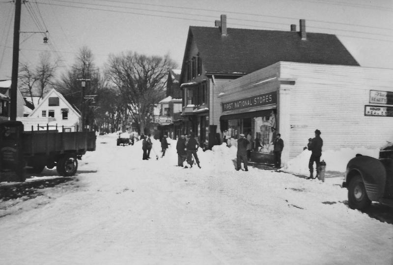 Teams of shovelers work on the February 1952 snow piles on Townsend Avenue. The First National was one of the two chain grocery stores in the Harbor's downtown; the other was the A&P on the site of Sherman's. The “National” site later became Bob's Photo-TV, and is now a popcorn store. The malling of the Meadow ended downtown chain groceries. Courtesy of the Boothbay Region Historical Society 1952