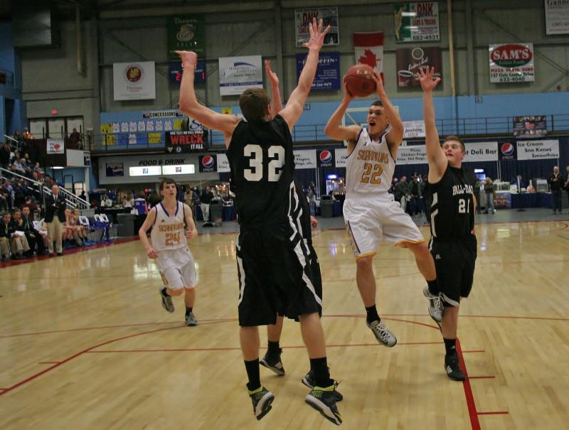 Senior captain Andrew Hallinan puts up a running shot against Hall-Dale during the first half of Monday’s Class C quarterfinal tournament game at the Augusta Civic Center. KEVIN BURNHAM/Boothbay Register Hallinan