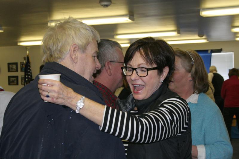 Pam Heino Aloupis hugs Howie Barter after his arrival. KEVIN BURNHAM/Boothbay Register