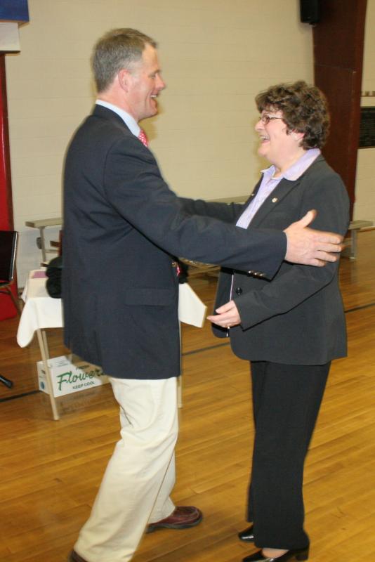 Y Administrative Assistant Doris Welch receives a gift and a hug from Executive Director Andy Hamblett for her 30 years of service. KEVIN BURNHAM/Boothbay Register Welch