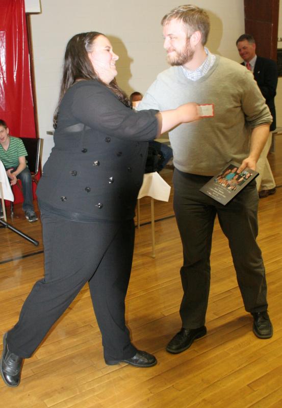 Joel Biron receives a Program Service Award from Emily Mirabile. KEVIN BURNHAM/Boothbay Register Biron