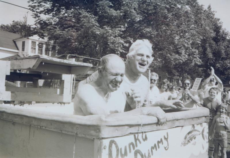 Elbridge Giles and Chetley Rittall enjoy a dunk in the tank at one of Boothbay’s celebrations on the Common. File photo