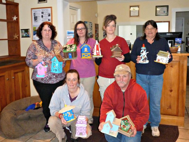 Staff members hold birdhouses. Top row from left, Nancy Bosio-Pickett, Lindsey Grover, Stephanie Freeman, and Tammy Chubbuck, bottom row, Blaisette Gauthier and Sam Dunning. Artists/staff members not pictured are Lauren Whitwicky, Julie Bryer, Emily Stevens, Nancy Lewis, and her daughter, Jenn Lodge. KATRINA CLARK/Boothbay Register