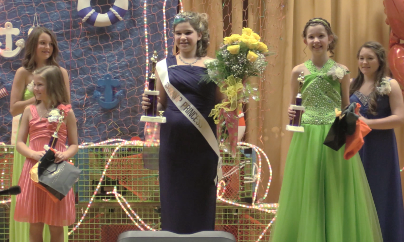 Miss Shrimp Princess 2014, Ciara Pitcher, holds a bouquet of yellow roses, center, while runners-up Sadie Yentsch, left, and Kalista Andrews, right, enjoy their trophies. Courtesy of Jonne Trees