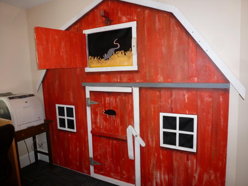 A fun display on the wall in the children's room. Open the upper hatch to find a rat in the hay! What's behind the lower hatch? KATRINA CLARK/Boothbay Register