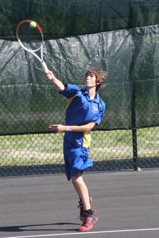 Third singles player Ray Perry serves during Tuesday’s match against Waynflete. KEVIN BURNHAM/Boothbay Register