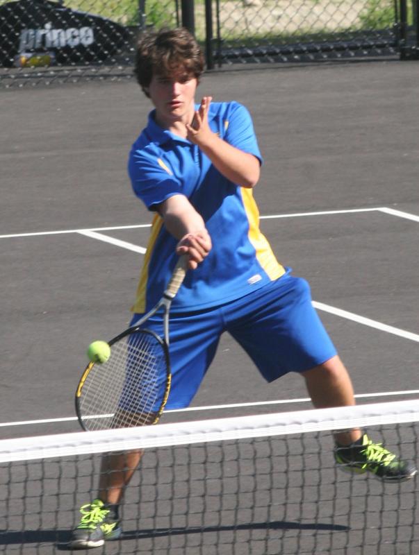 First doubles player Ben Betts attempts a drop shot at the net on Tuesday against Waynflete. KEVIN BURNHAM/Boothbay Register