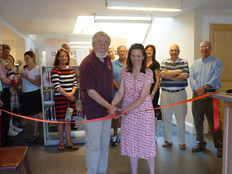 Director of the Boothbay Harbor Memorial Library Tim McFadden and Nicole Poulton, president of the library trustees, cut the ribbon on Saturday, June 28 marking the official grand opening of the newly renovated Boothbay Harbor Memorial Library. KATRINA CLARK/Boothbay Register